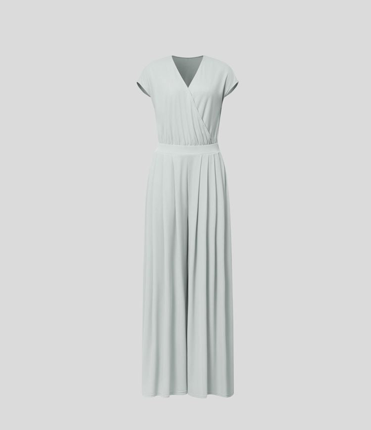 Jumpsuit™ - Tuta with V-shaped collar, short sleeve, side pocket with pieghe and wide leg, fluid wave pattern.