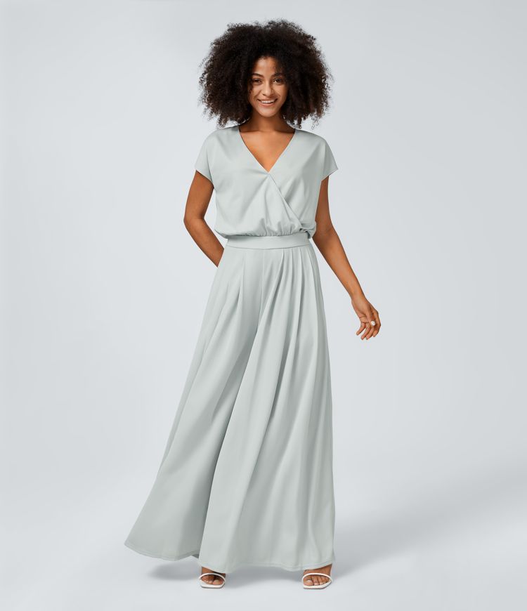 Jumpsuit™ - Tuta with V-shaped collar, short sleeve, side pocket with pieghe and wide leg, fluid wave pattern.
