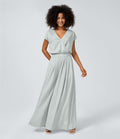 Jumpsuit™ - Tuta with V-shaped collar, short sleeve, side pocket with pieghe and wide leg, fluid wave pattern.